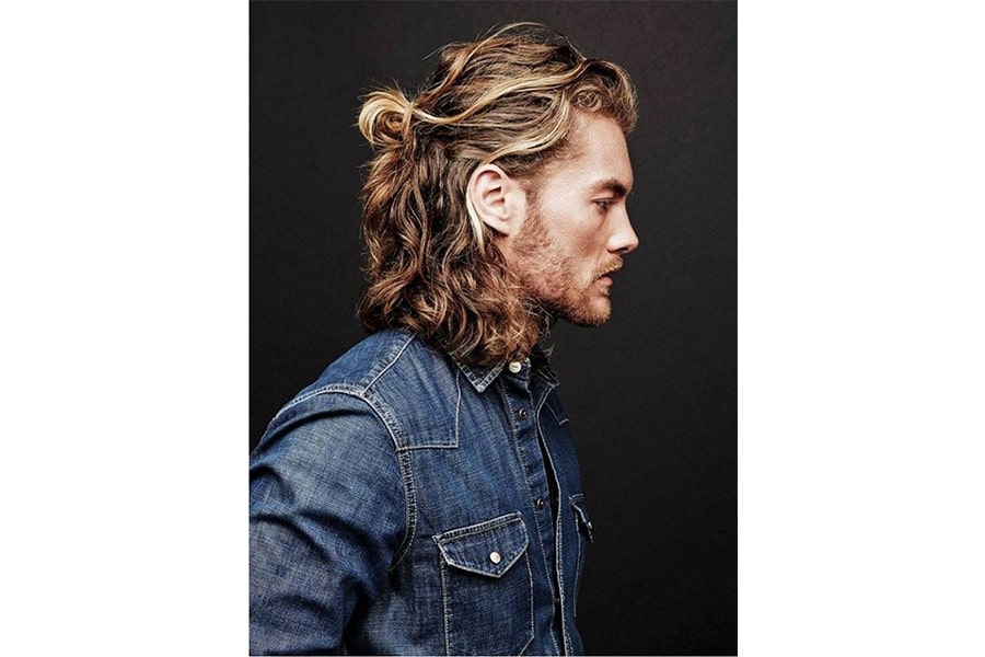 curly casual man bun with unruly beard