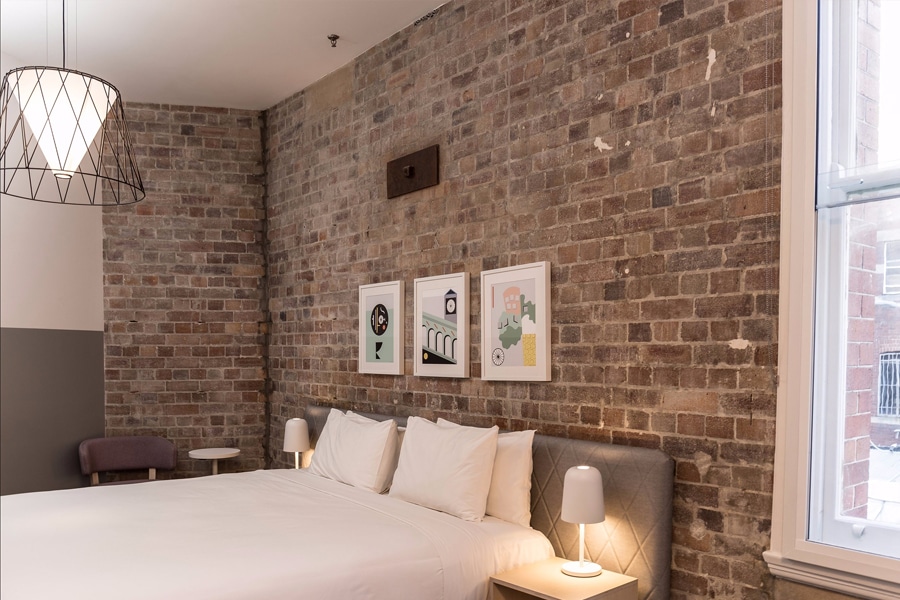the ultimo brick wall hotel room