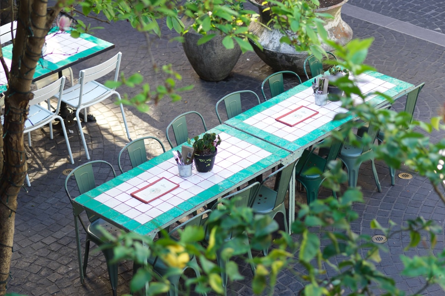 Table in outdoor dining space beresford hotel