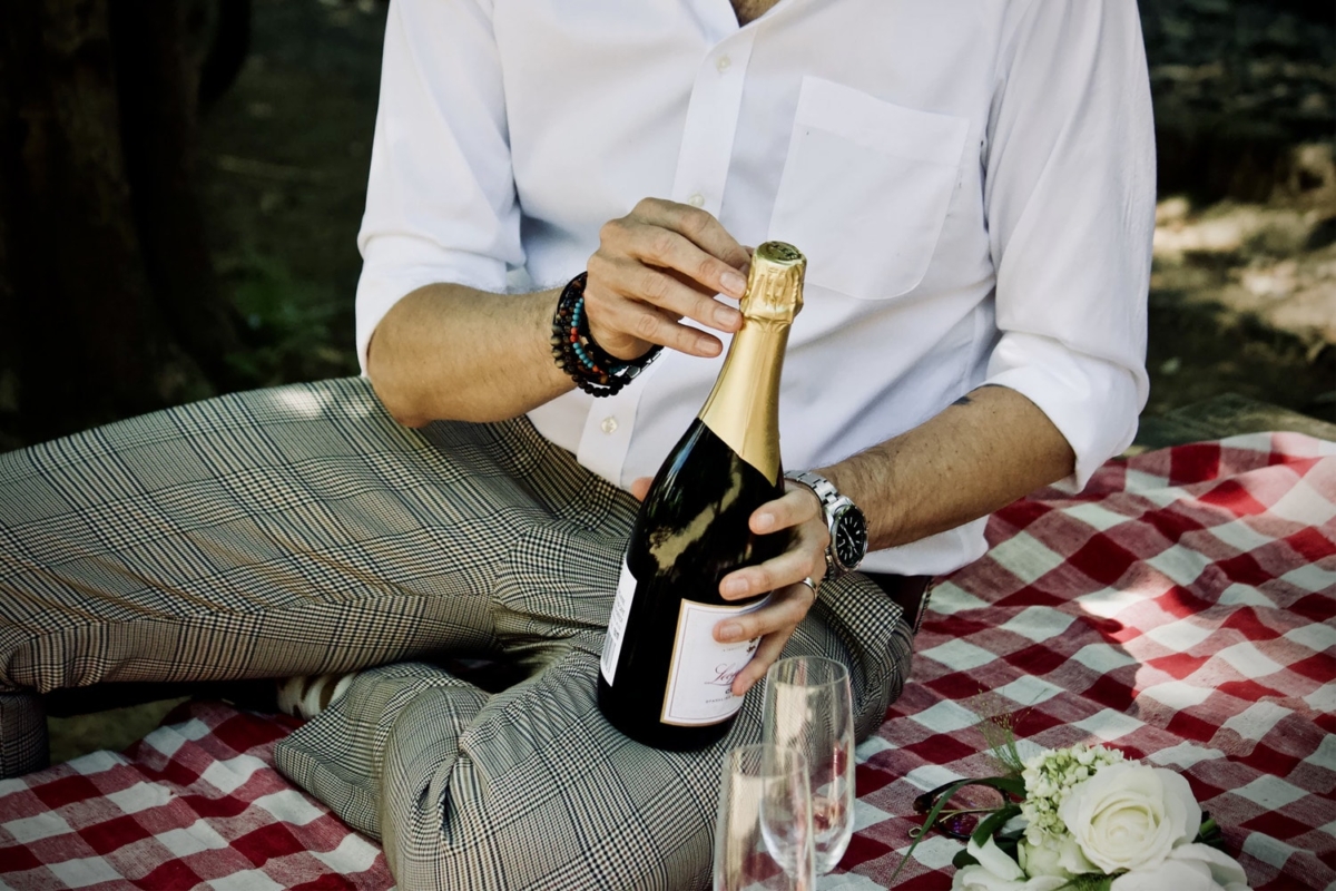 A man holding a champagne bottle