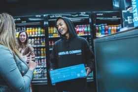 Jaden Smith holding a box of Just Water