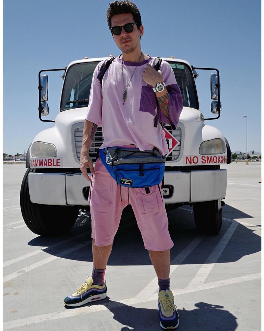 john Mayer in pink outfit and bumbag