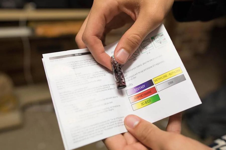 Person Holding Pill Testing Kit