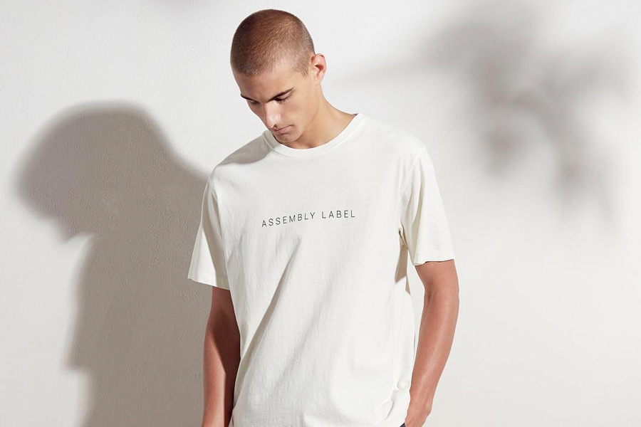 male model in assembly label white tshirt