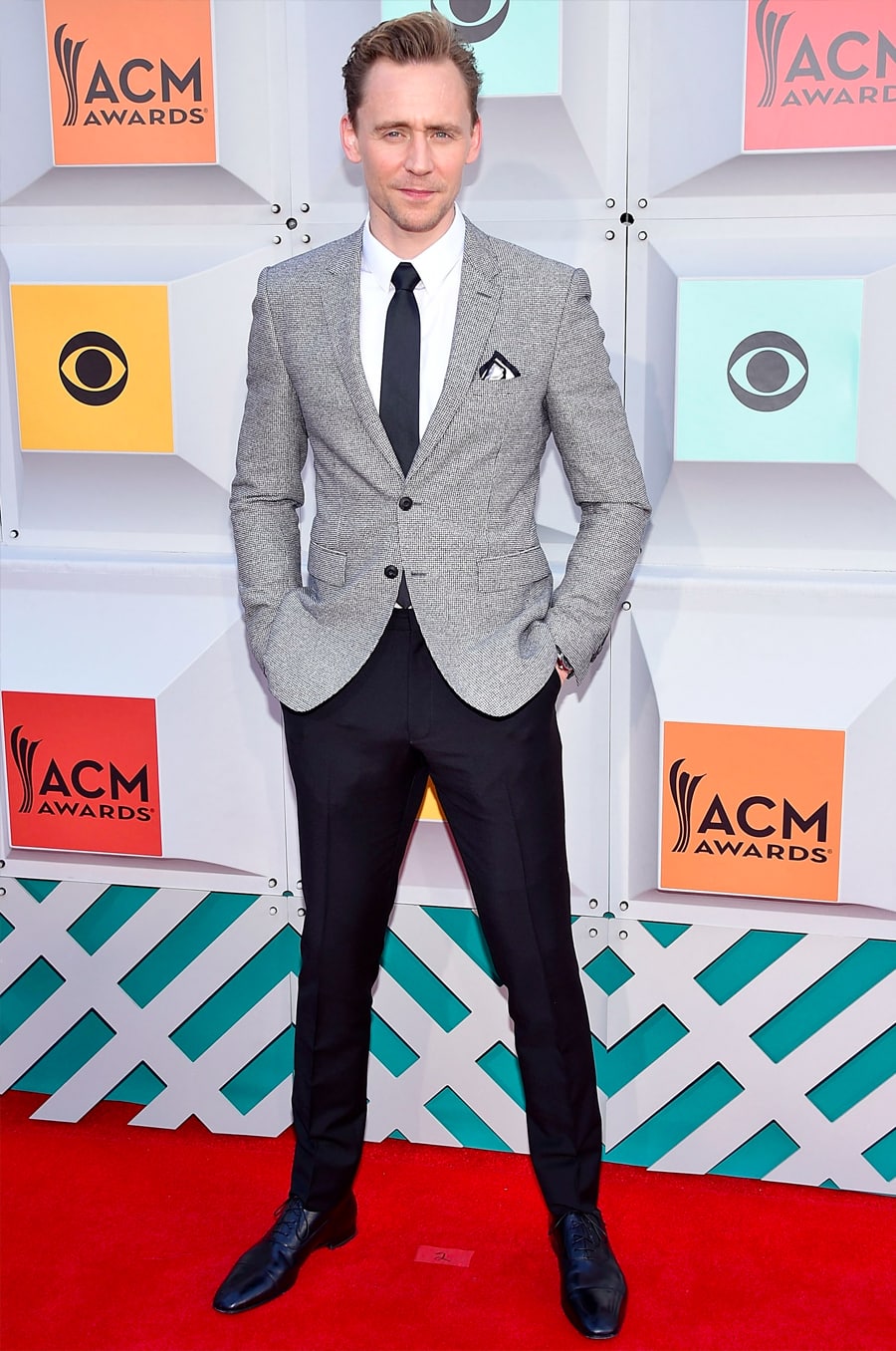 grey blazer and black pants