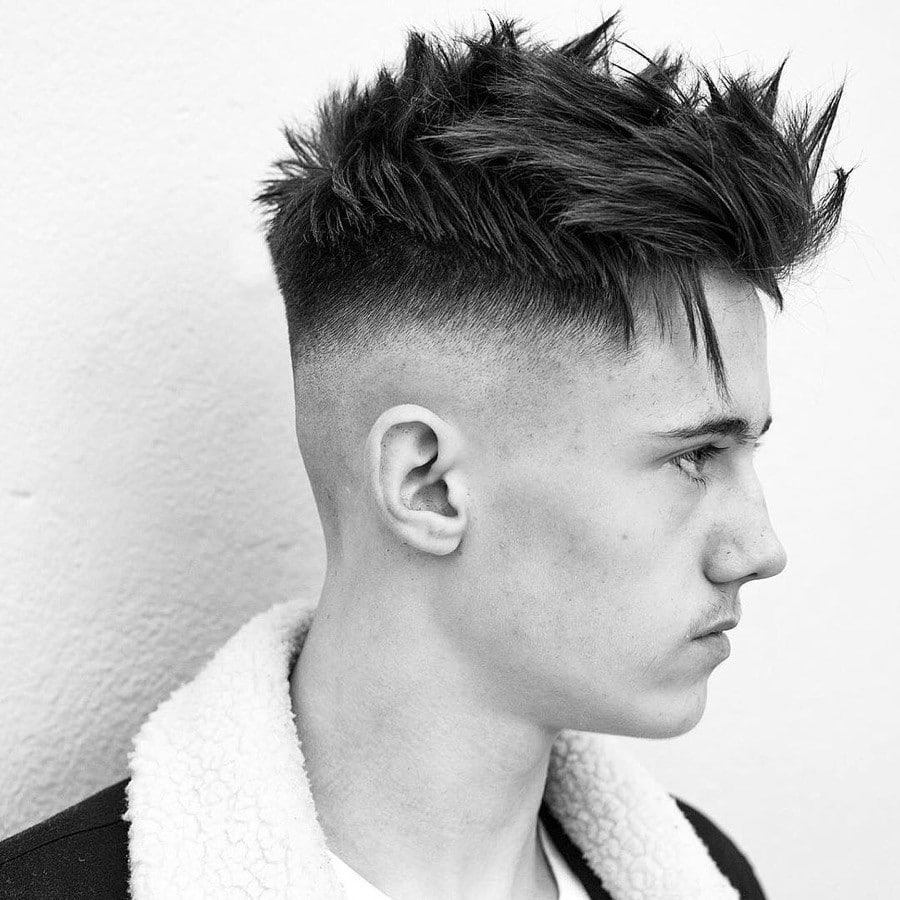 short skin fade with spikey hair on man