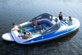 sun bathing in inflatable speed boat at sea