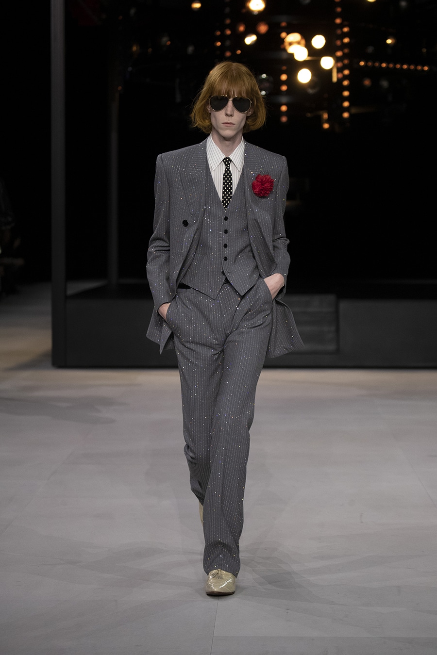 Model in shiny Pinstripe Suit