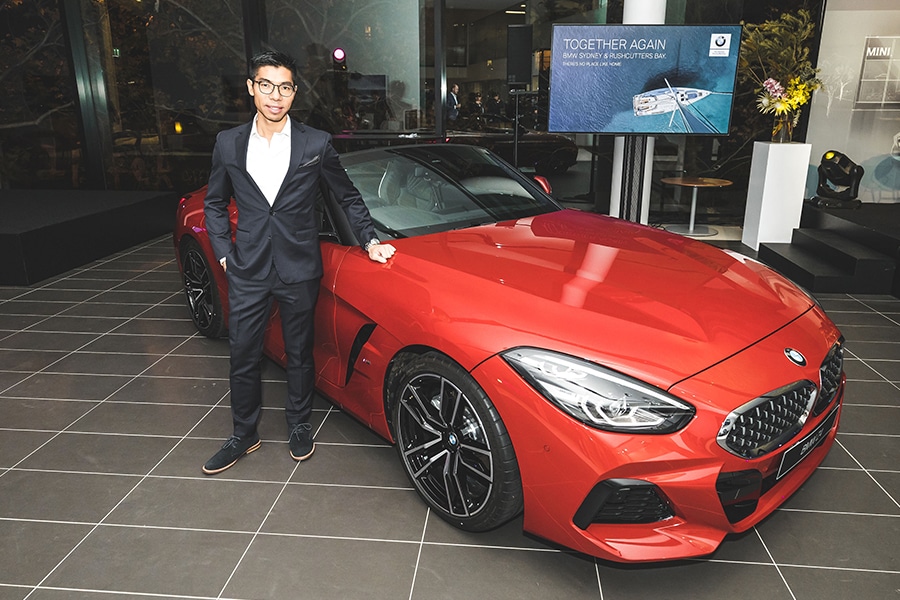Calvin Luk BMW Designer standing in front of car