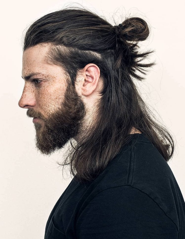 Man with long hair wearing a headband