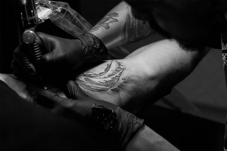 Black and White Tattoo Artist Working