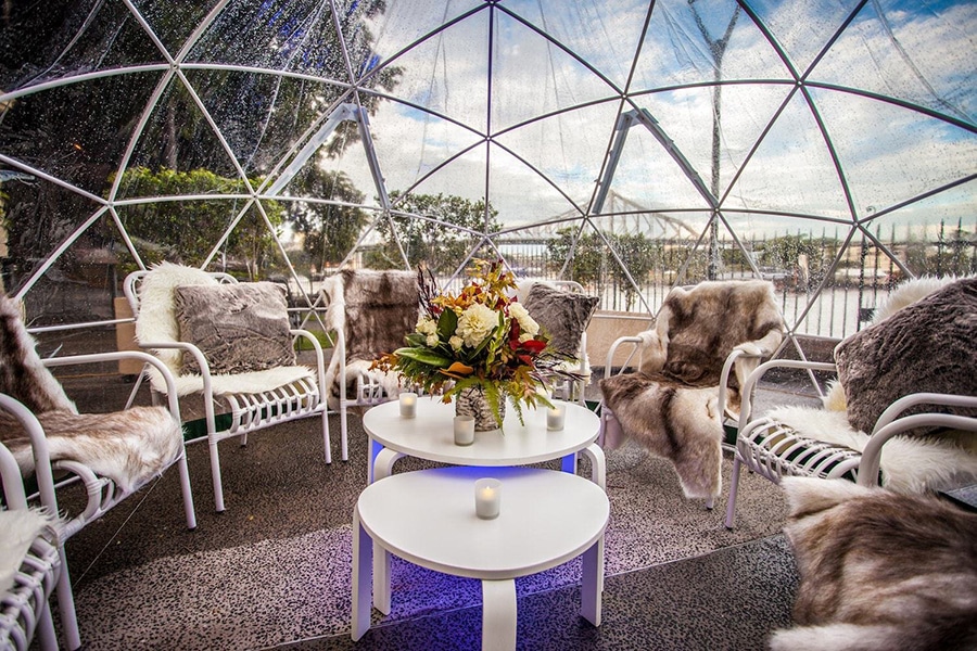 beautiful chairs and flowers inside the garden dome igloo