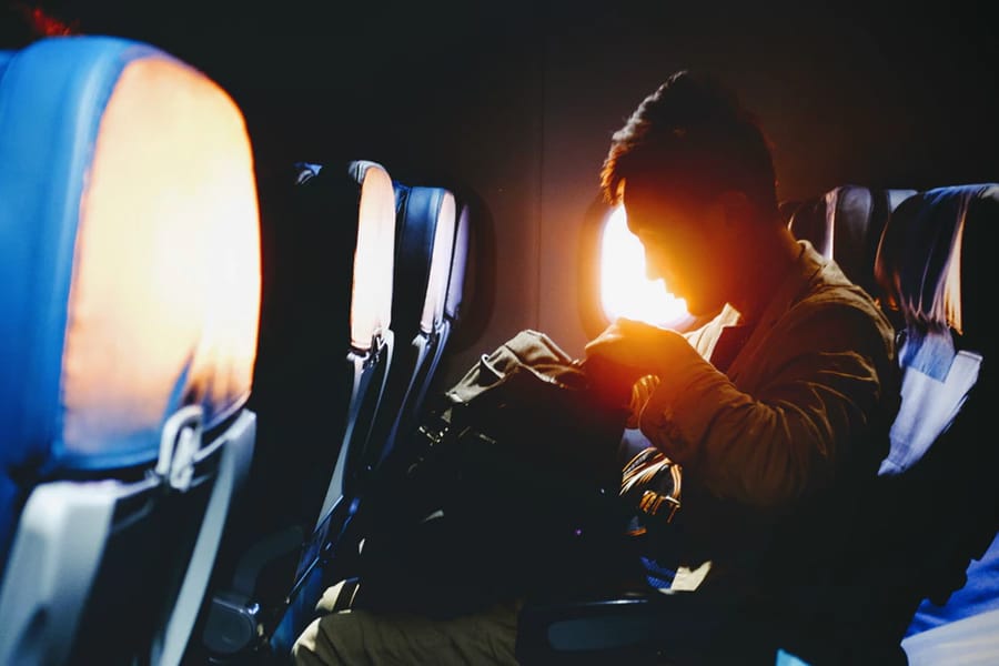 Silhouette of man on plane