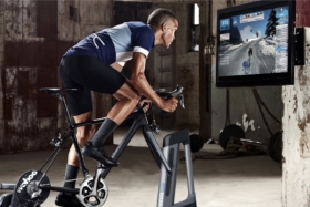 Man working out on Kickr Climb
