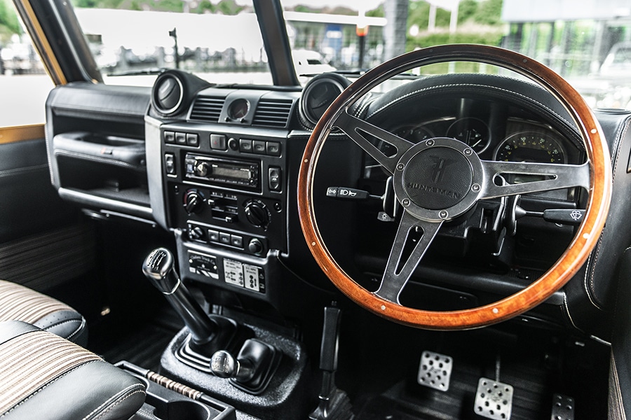 land rover steering wheel and dashboard of defender vehicle