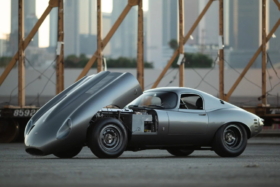 Low Drag Jaguar E-Type with opened front hood from side