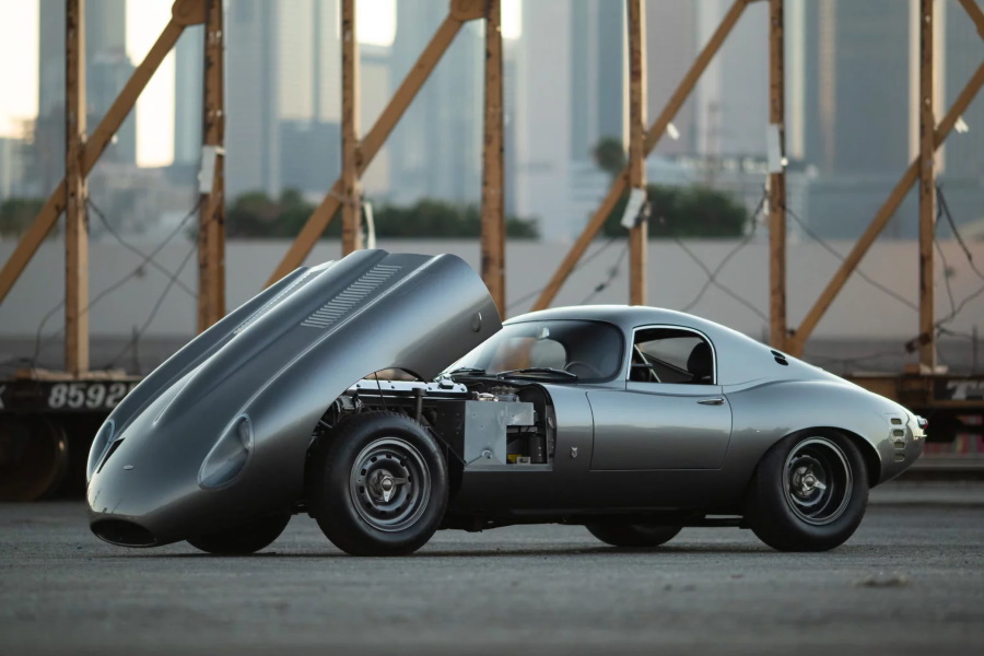 Low Drag Jaguar E-Type with opened front hood from side