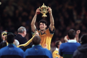 John Eales lifts the Web Ellis Cup after his Australia side defeated France