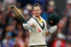 Steve Smith raising his bat