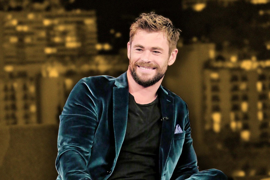 Medium shot of Chris Hemsworth in a velvet suit