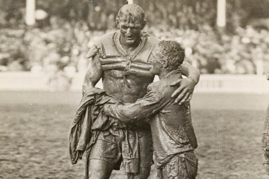 St George captain Norm Provan and Western Suburbs counterpart Arthur Summons’ mud-caked embrace