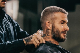 Side of a man getting a haircut