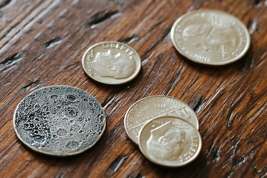 Full moon silver coin placed in table