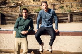 Two models near a fence wearing Olivers Apparel Passage Pant