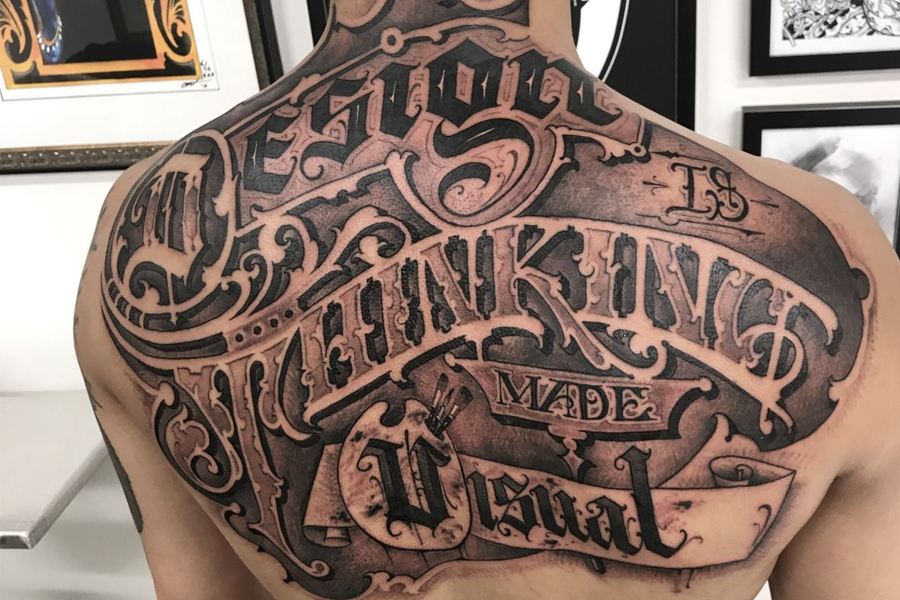 tattoos for men on chest lettering