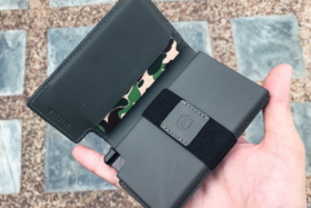 Unfolded Ekster Smart Wallet on a hand