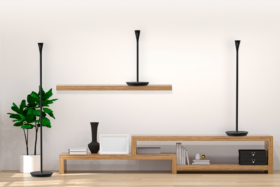 Panasonic HomeHawk Floor Lamps on shelf, table and floor along a wall