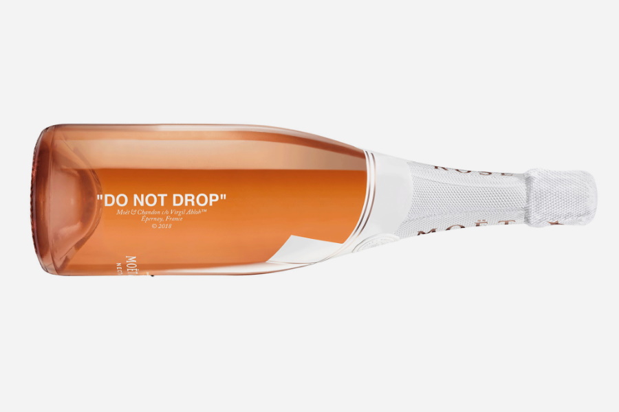 Bottle of Off-White x Moet & Chandon Impérial Rosé Champagne on its side with "DO NOT DROP" print