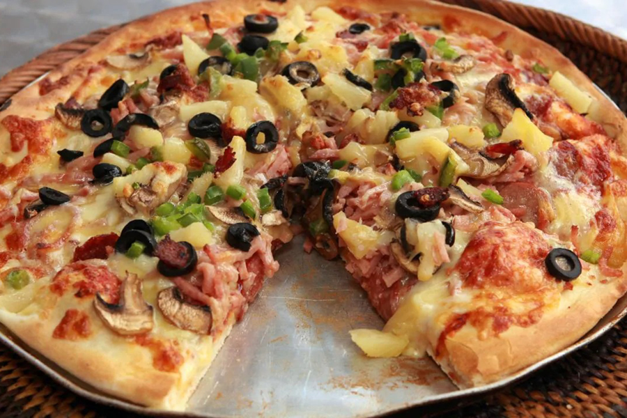 pizza with olives and pinapple topping