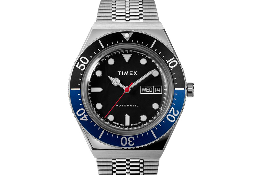 Dial of Timex M79 Automatic Batman watch with Black dial and half blue / half black bezel