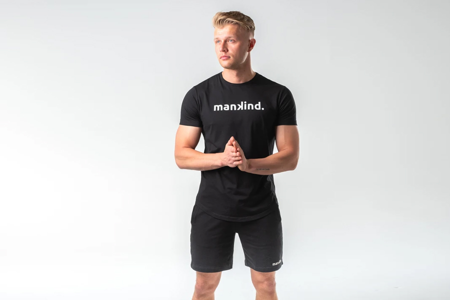 A model in Mankind Tech Tee