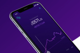 A phone with Spaceship Voyager Investment app open