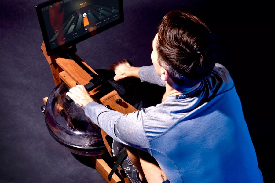 A man training on Ergatta Connected Water Rower