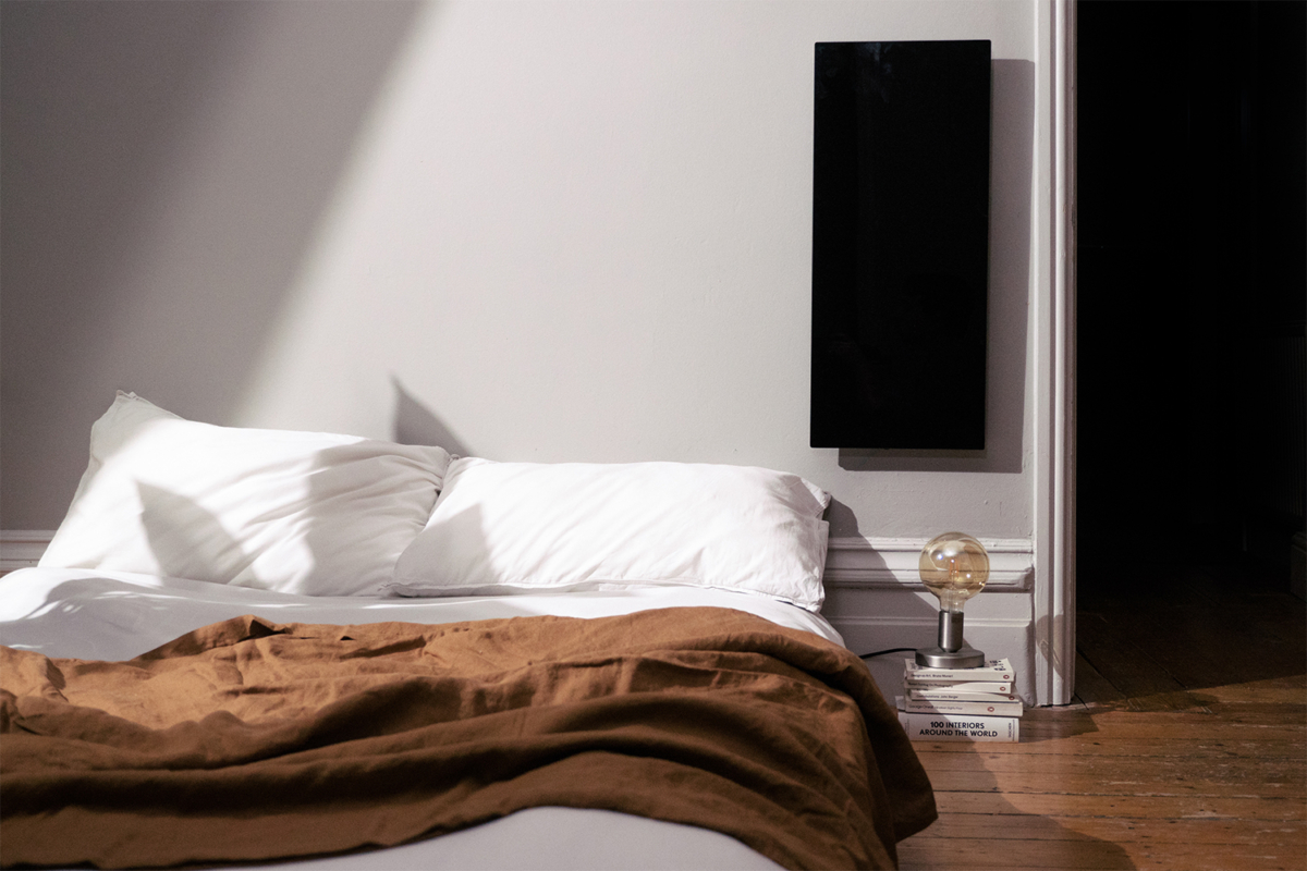 KOLEDA heater on a wall in a bedroom