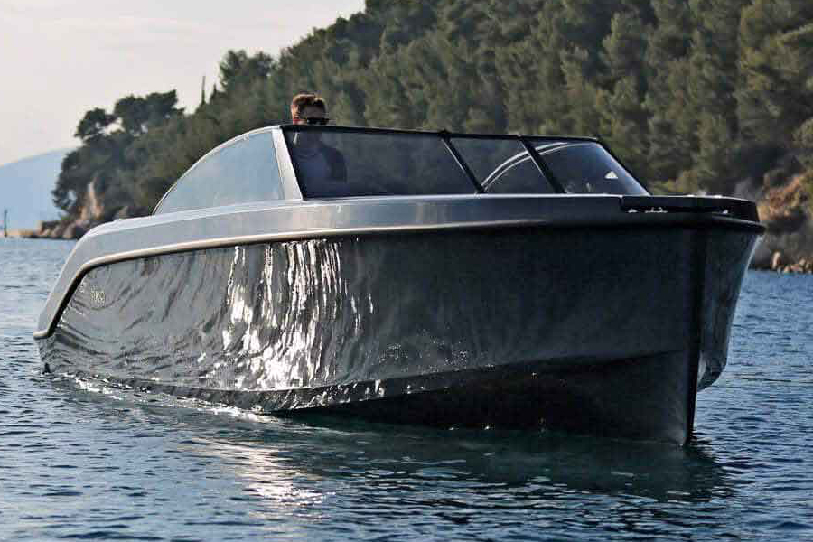 A man on a Rand Leisure 28 Electric Boat