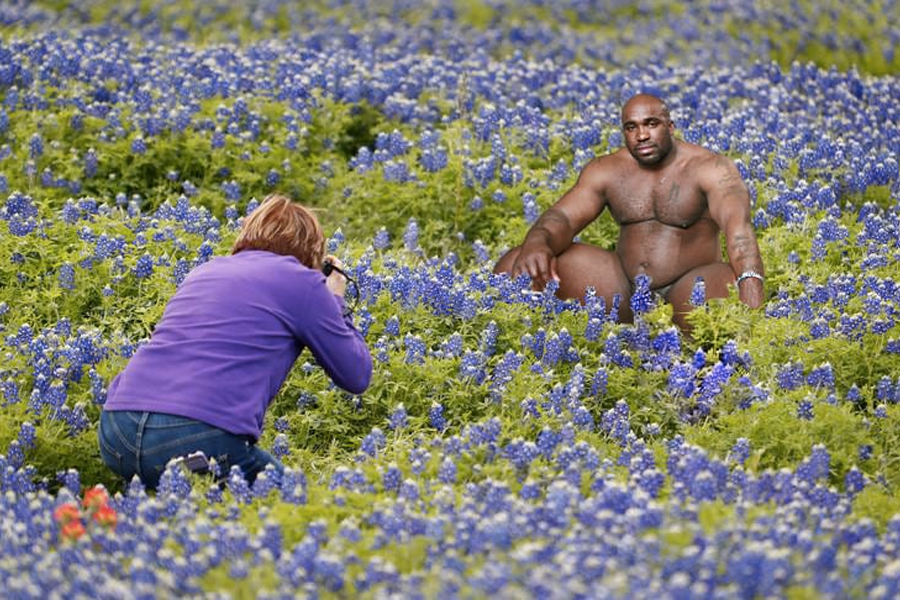 Edited photo of naked Barry Wood in the middle of a lavender field being photographed