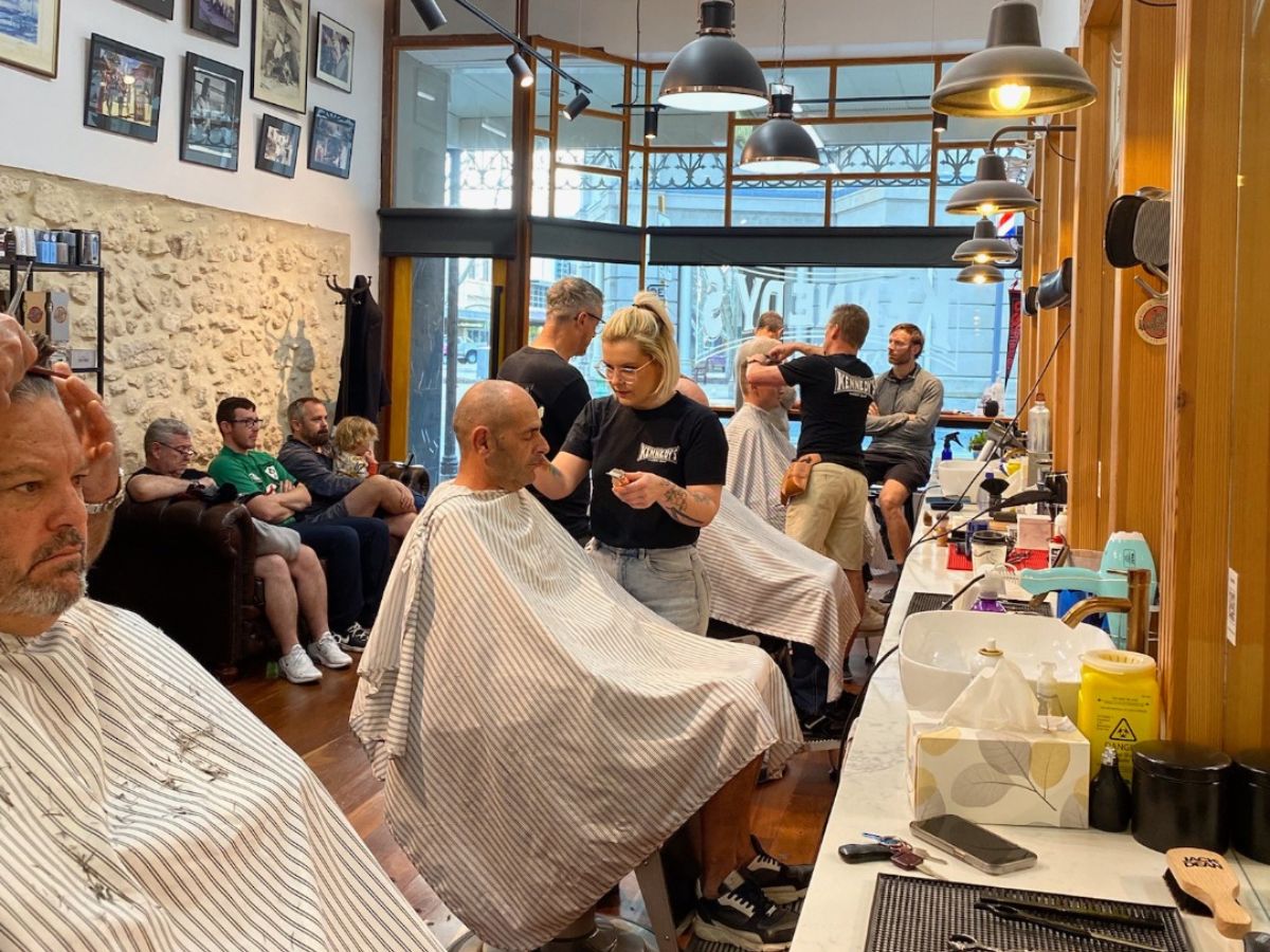 People getting haircut at Kennedy’s Barber Shop