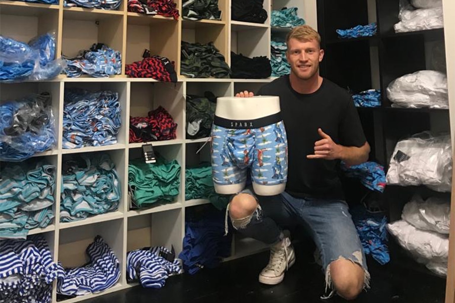 Patrick Psotka holding a blue pair of Sparx underwear