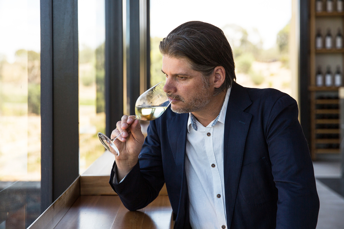 Peter Munro smelling wine