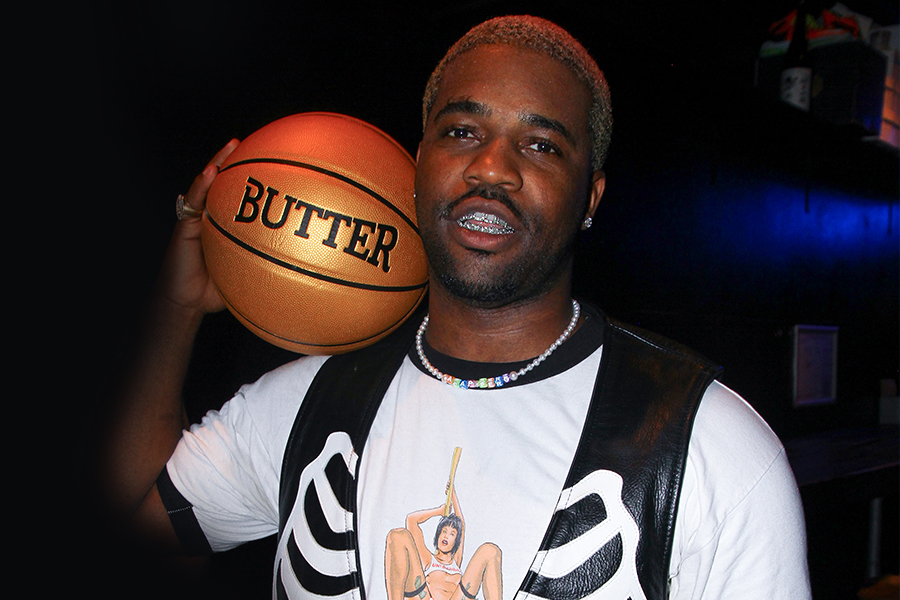 ASAP Ferg holding a basketball on his shoulder