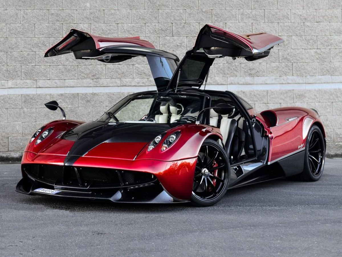 Pagani Huayra three quarter front with open gull-wing doors