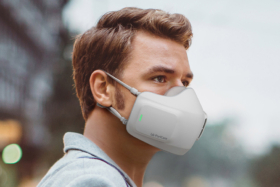 man wears LG Wearable Air Purifier