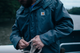 Torso of a man wearing a Carhartt jacket