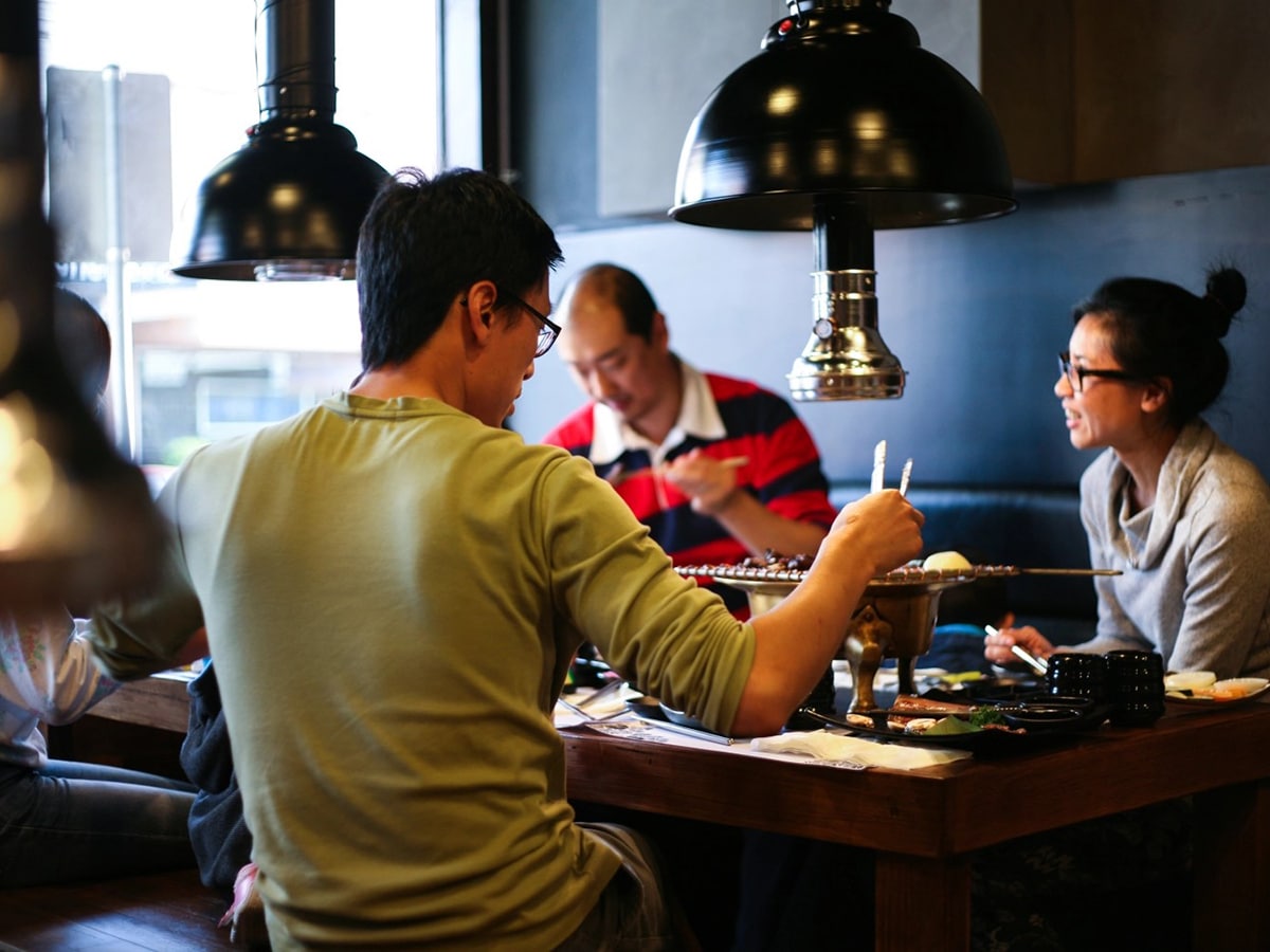 12 spots for the best korean bbq in melbourne towoo charcoal people eating barbecue at towoo charcoal