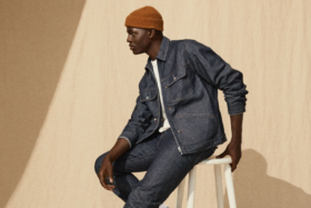 A model wearing H&M denim jacket and trousers with a white t-shirt