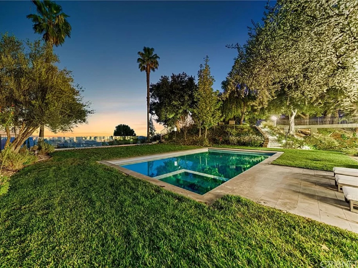 Pool in the middle of a yard at Bell Canyon Mansion